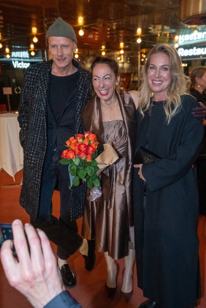 Guests celebrating with flowers at a film premiere in Stockholm – event photographer