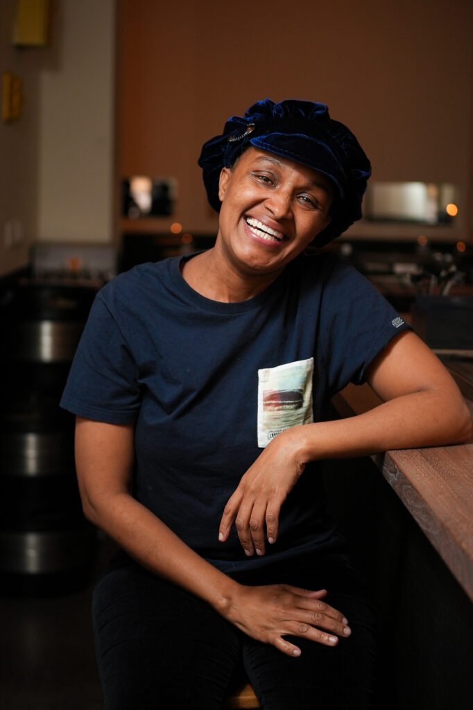 Relaxed portrait of a smiling woman in a restaurant, Stockholm portrait photographer